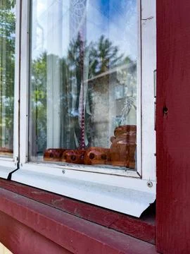 Rustic Window with Clay Figurines and Lace Curtains Stock Photos