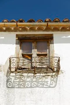 Rustic window in facade of the town of Hervas, Caceres Stock Photos