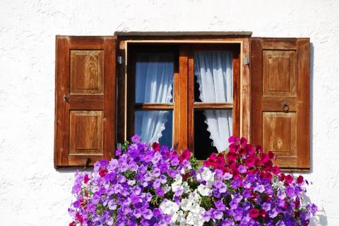 Rustic window with flower decoration Stock Photos