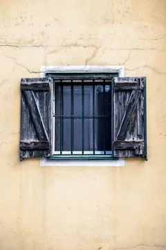 Rustic Window with Iron Bars Stock Photos