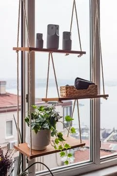 Rustic Window Shelving: DIY Rope Hanging Organizer with Indoor Plants Stock Photos