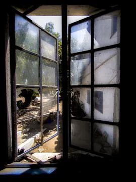 Rustic window view revealing a tranquil outdoor landscape Fotos de archivo