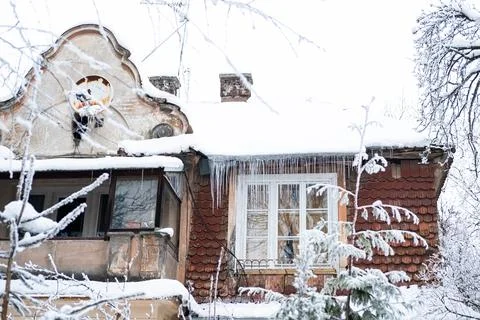 Rustic windows with icicles in winter Stock Photos