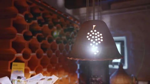 Rustic Wine Cellar Close-Up with Decorative Grape Pendant Lamp Stock Footage 340001459