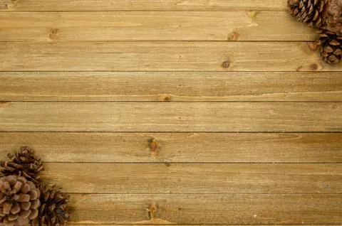 Rustic wood plank background with pine cones Stockfoto's
