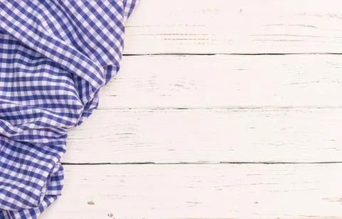 Rustic wood table background with blue tablecloth Stock Photos