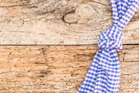 Rustic wood table background with blue napkin Stock Photos