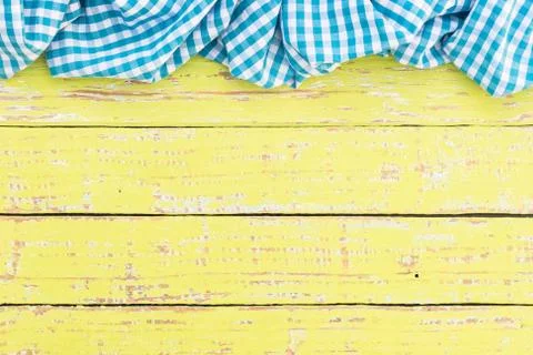 Rustic wood table background with blue tablecloth Stock Photos