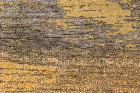 Rustic wood texture or background with yellow paint.  Close-up. Stock Photos