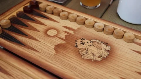 Rustic wooden backgammon board with dice in play Stock Footage 307232088