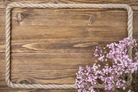 Rustic wooden background with rope frame Stockfoto's