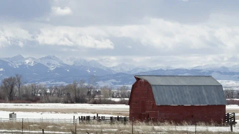 Rustic wooden barn on a snow covered landscape Stock Footage 113236088