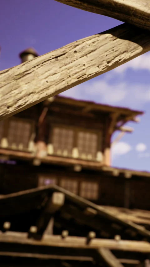 Rustic wooden beams frame a charming building under a bright blue sky Stock Footage 331807166