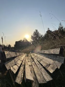 Rustic Wooden Beams Structure in Tall Grass at Sunset Zlatibor Serbia Fotos Stock