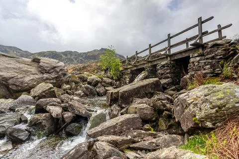 Rustic Wooden Bridge over Mountain Stream, Cwm Idwal, Ogwen Valley, North Wal Stock Photos