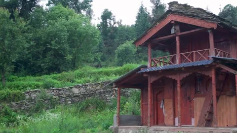 Rustic wooden cabin in green forest landscape Stock Footage 339949602