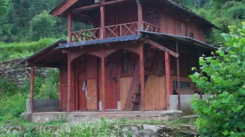 Rustic wooden cabin in green forest landscape Stock Footage 339949680