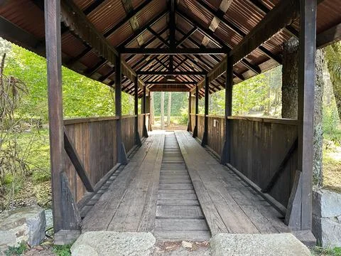 Rustic wooden covered bridge Stock Photos