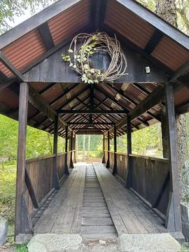 Rustic wooden covered bridge Stock Photos
