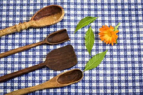 Rustic wooden spoons on the table. Stock Photos