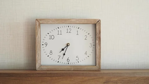 Rustic wooden square clock on shelf shows time passing through smooth handh.. Vídeos de archivo 332744856