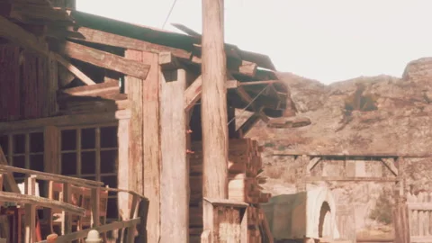 Rustic Wooden Structure Stands Proudly Against a Beautiful Mountainous Backdrop Stock Footage 344950815