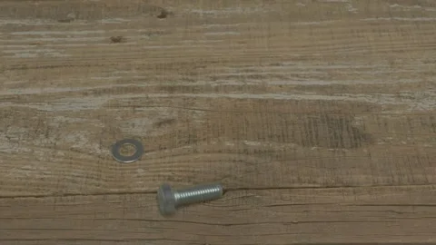 A Rustic Wooden Surface Featuring a Circular Metal Object for Artistic Видео 283457875