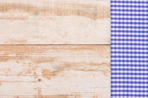 Rustic wooden table background with blue napkin Stock Photos