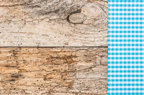 Rustic wooden table background with blue napkin Stock Photos