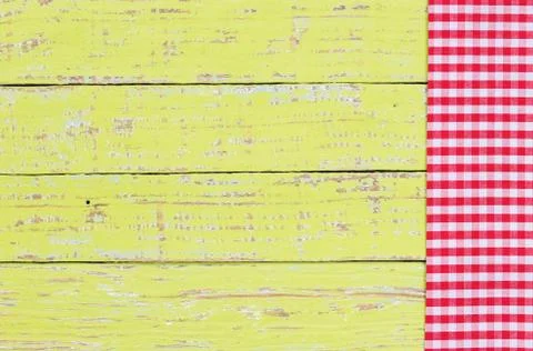 Rustic wooden table background with red checked napkin Stock Photos