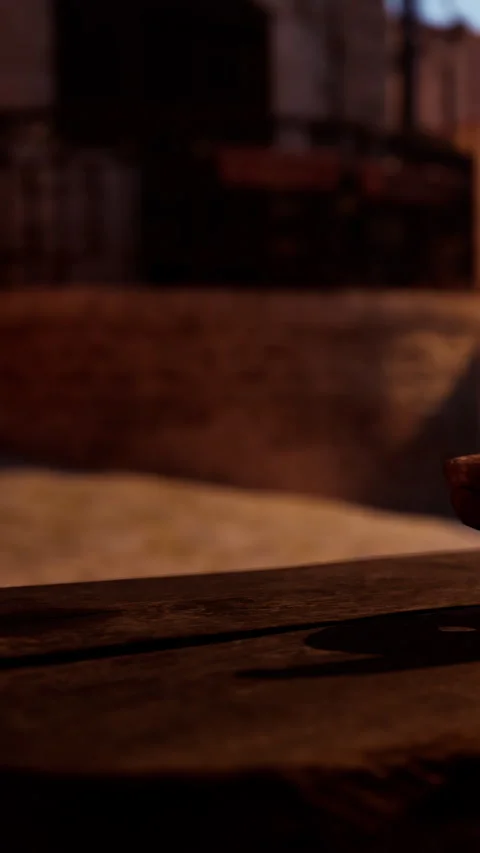 Rustic wooden table in a dimly lit setting with brick walls Stock Footage 339505527