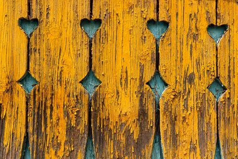 Rustic wooden wall with carved pattern. Old painted planks in orange color Foto stock