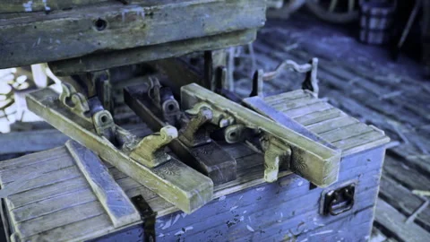 Rustic workbench holding aged clamping tools and guiding devices Stock Footage 333993117