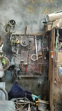 Rustic Workshop With Tools Hanging On Wooden Wall Stock Photos