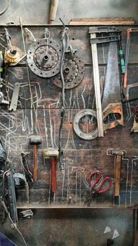 Rustic Workshop With Tools Hanging On Wooden Wall Stock Photos