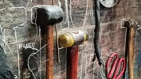Rustic Workshop With Tools Hanging On Wooden Wall Stock Photos