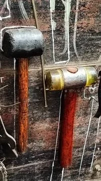 Rustic Workshop With Tools Hanging On Wooden Wall Foto stock