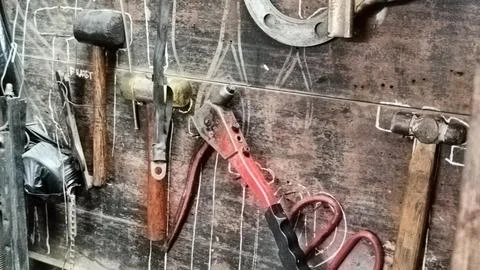 Rustic Workshop With Tools Hanging On Wooden Wall Stock Photos