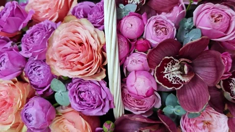 Rustic Woven Basket Overflowing with Roses and Peonies Stock Footage 312472833
