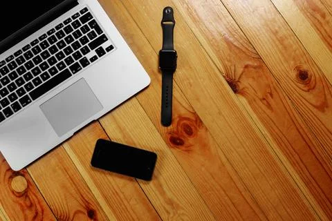 Rustik, worker, wooden table top view, flat. Business items on the table, lap Stock Photos