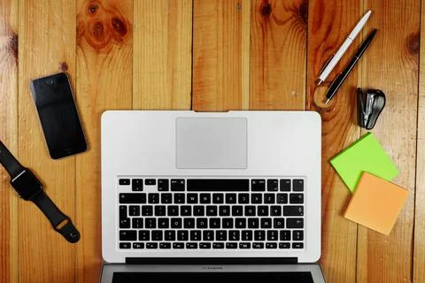 Rustik, worker, wooden table top view, flat. Business items on the table, lap Stock Photos