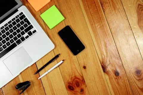 Rustik, worker, wooden table top view, flat. Business items on the table, lap Stock Photos