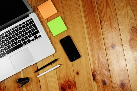 Rustik, worker, wooden table top view, flat. Business items on the table, lap Stock Photos