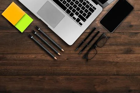 Rustik, worker, wooden table top view, flat. Business items on the table, lap Stock Photos