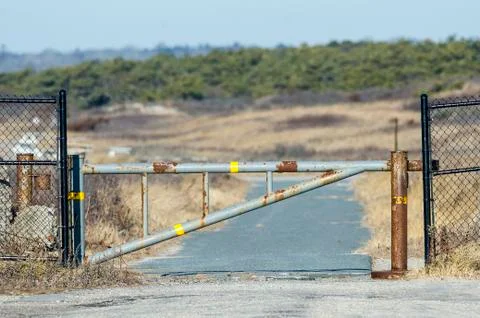 Rusting gate on path Stock Photos