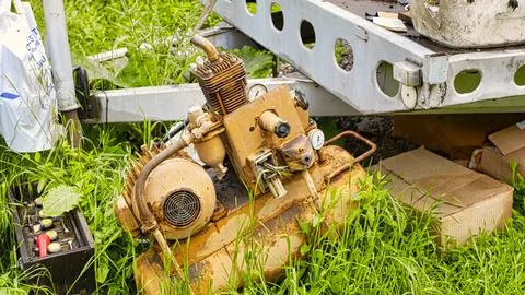 Rusting Generator Behind Old Trailer in Brno Junkyard, Czech Republic Stock Photos