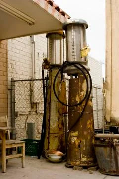 Rusting Old Gas Pumps in Back of Building Stock Photos