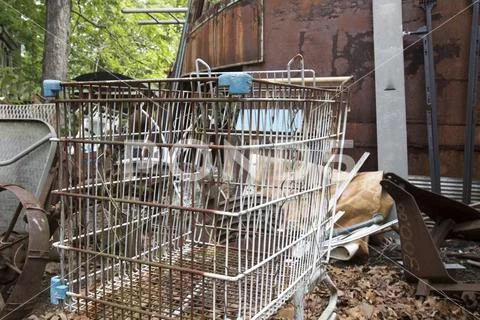 Rusting shopping cart in junkyard Stock Photos