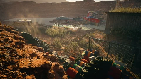 Rusting vehicles and debris in a desolate desert landscape. Stock Footage 318320733