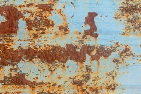 Rust.Old blue painted wall with rust spots.Textured rusty metal background. R Stock Photos